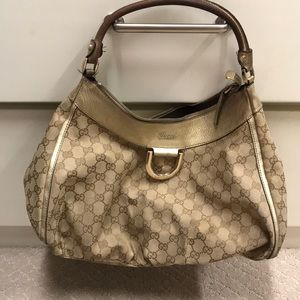 Gucci monogram hobo bag in gold/canvas
